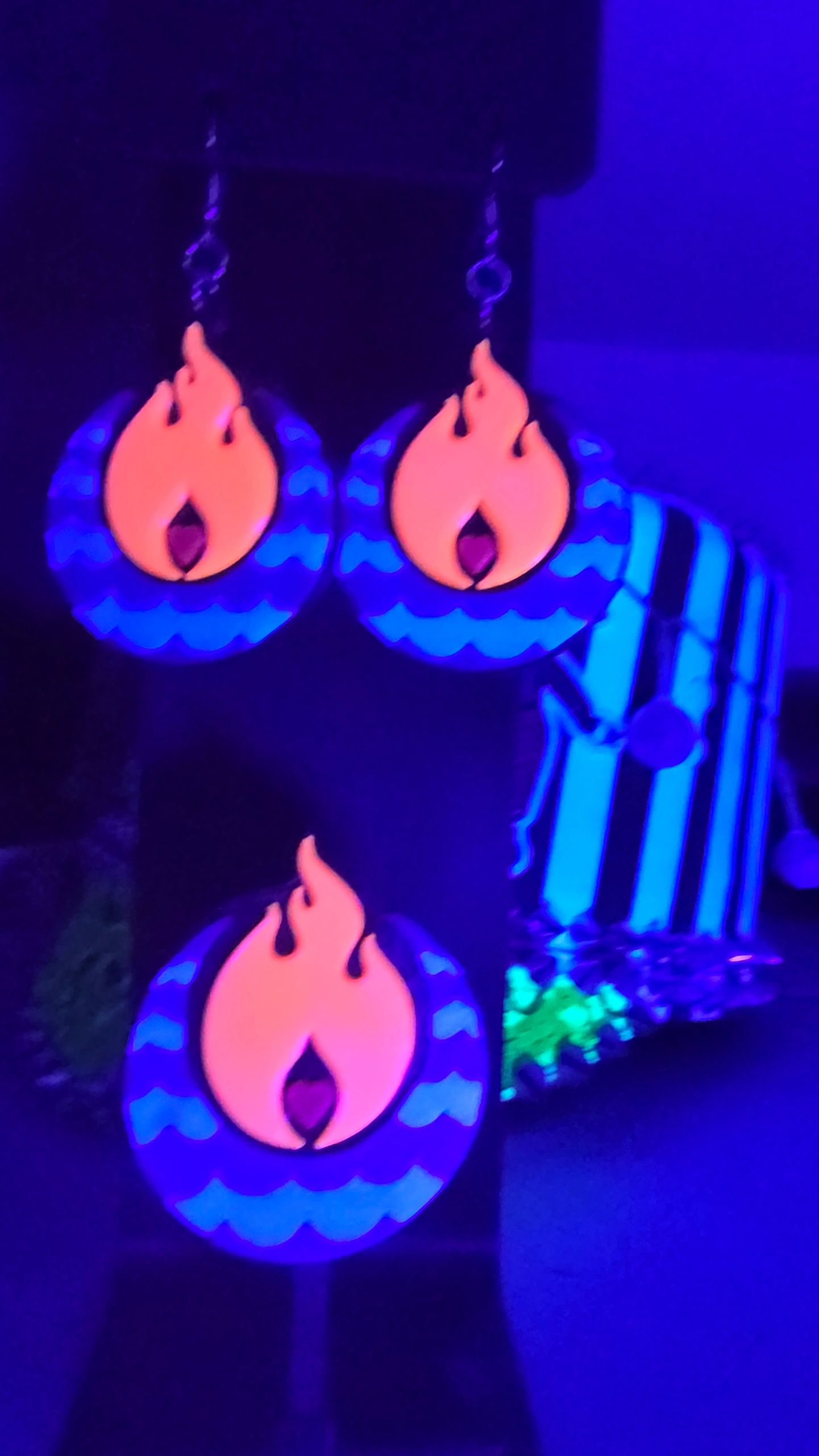 Engulf Earrings, photographed under UV light