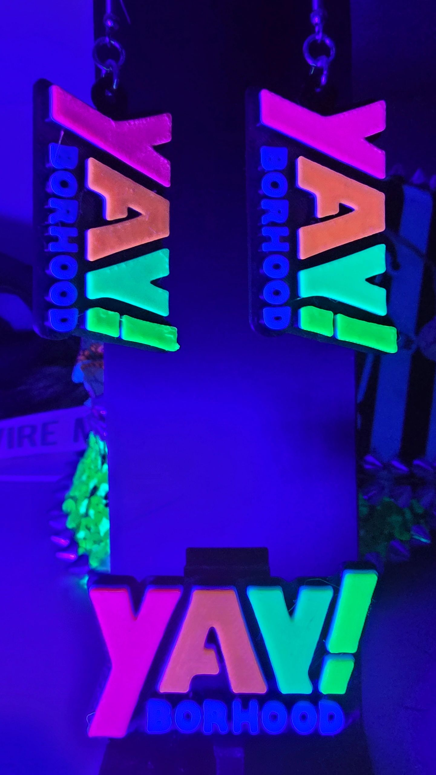 YAY!borhood earrings, photographed under UV light